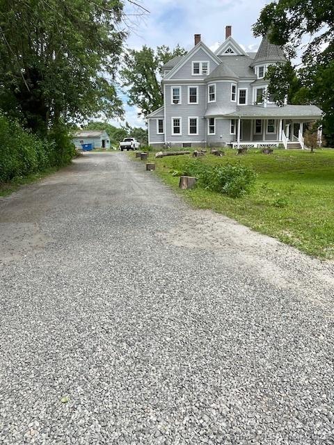 2 Judd Ave, Bethel, CT 06801 - view of front of house with a porch, a chimney, and driveway