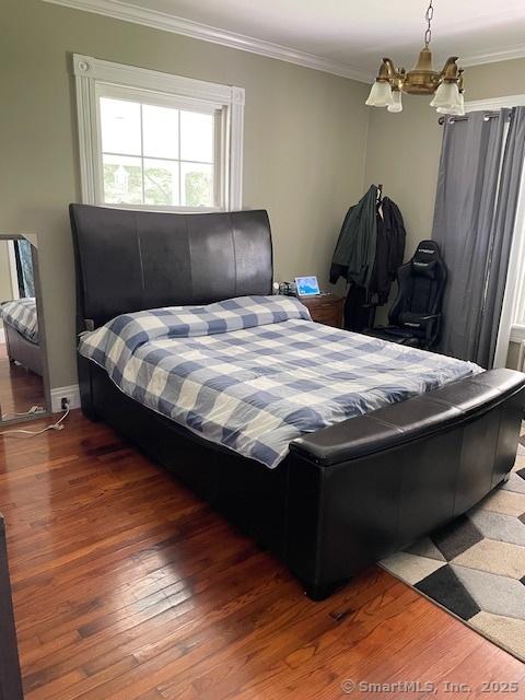 2 Judd Ave, Bethel, CT 06801 - bedroom with a chandelier, crown molding, and wood finished floors