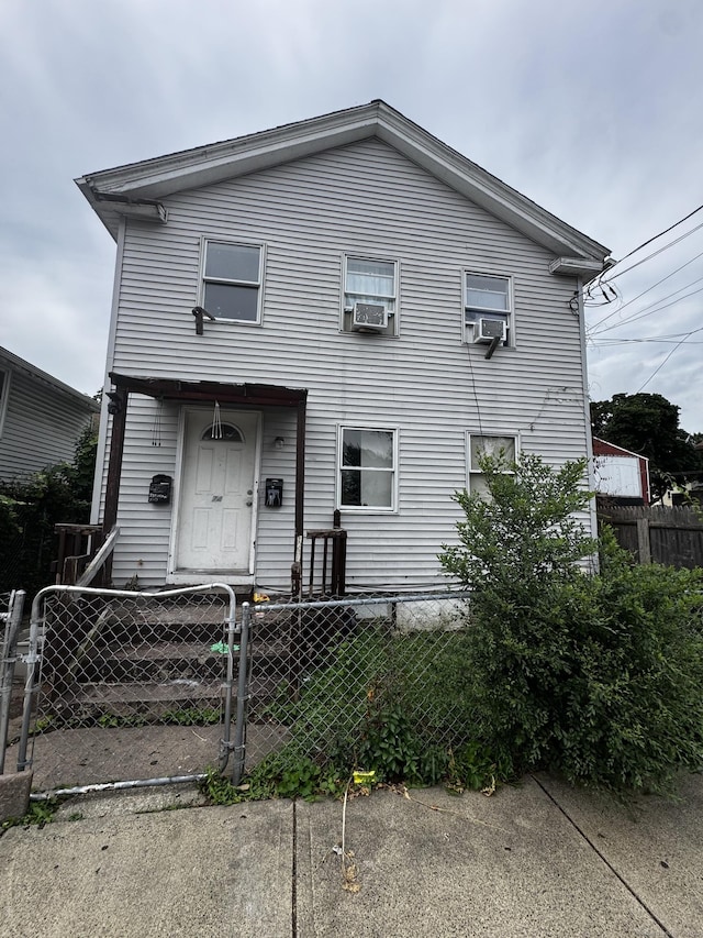 74 Fillmore St, New Haven, CT 06513 - townhome / multi-family property with a fenced front yard, a gate, and cooling unit