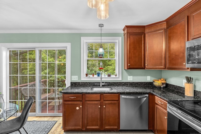 41 Palmer St Unit 20, Norwich, CT 06360 - kitchen featuring stainless steel appliances, decorative light fixtures, crown molding, dark stone counters, and light wood-type flooring