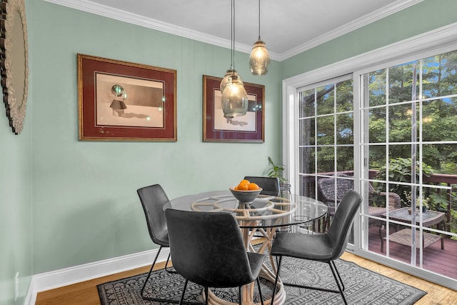 41 Palmer St Unit 20, Norwich, CT 06360 - dining area with crown molding and light wood-style floors
