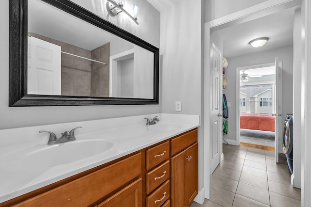 41 Palmer St Unit 20, Norwich, CT 06360 - ensuite bathroom with double vanity, tile patterned flooring, a tile shower, ceiling fan, and washer / clothes dryer