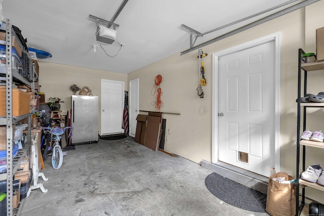 41 Palmer St Unit 20, Norwich, CT 06360 - garage with freestanding refrigerator and a garage door opener