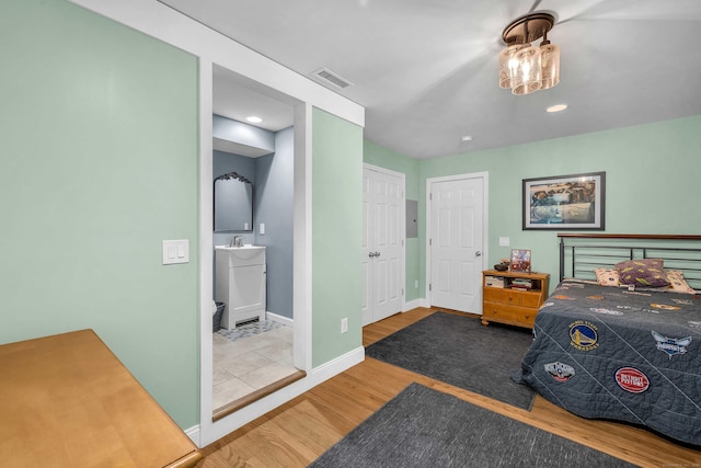 41 Palmer St Unit 20, Norwich, CT 06360 - bedroom with wood finished floors and ensuite bath