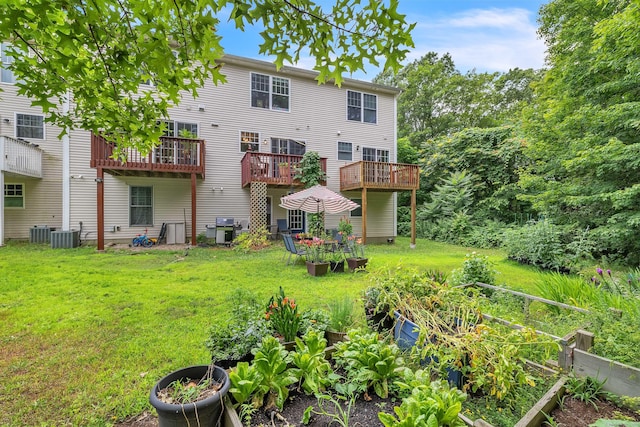 41 Palmer St Unit 20, Norwich, CT 06360 - rear view of house featuring a garden and a lawn