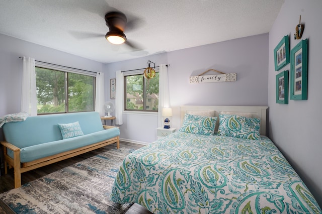143 Sandy Point Rd Unit 143, Old Saybrook, CT 06475 - bedroom featuring wood finished floors, a ceiling fan, and a textured ceiling