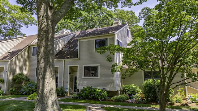 143 Sandy Point Rd Unit 143, Old Saybrook, CT 06475 - view of front facade featuring a chimney