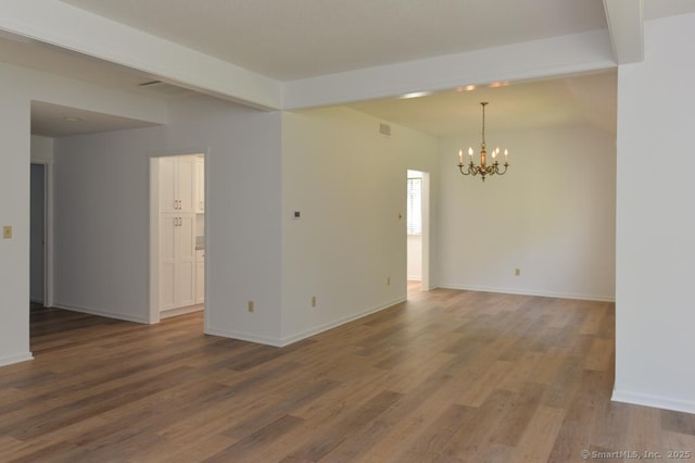 648 Heritage Vlg Unit A, Southbury, CT 06488 - unfurnished room featuring a chandelier and wood finished floors