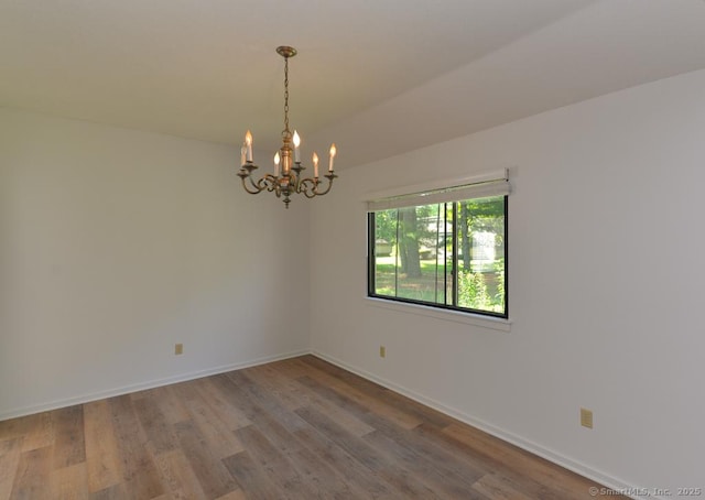 648 Heritage Vlg Unit A, Southbury, CT 06488 - unfurnished room featuring a chandelier and wood finished floors