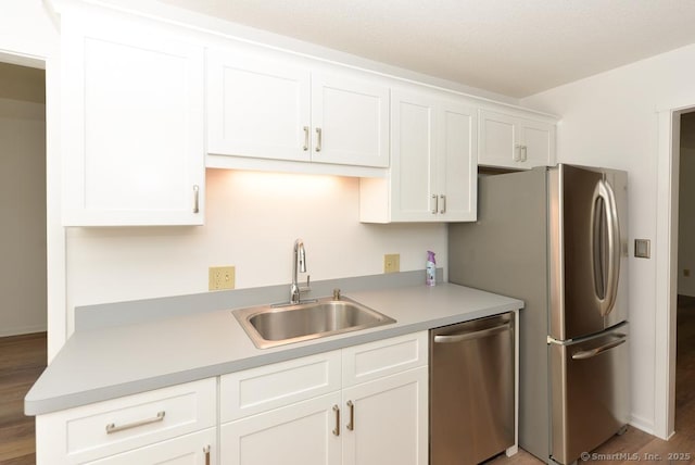 648 Heritage Vlg Unit A, Southbury, CT 06488 - kitchen with appliances with stainless steel finishes, white cabinetry, and light countertops