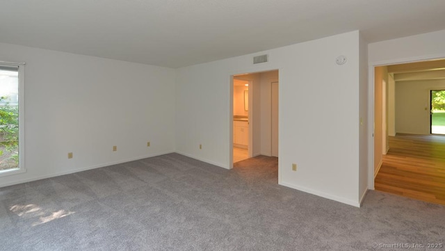 648 Heritage Vlg Unit A, Southbury, CT 06488 - empty room featuring carpet and baseboards