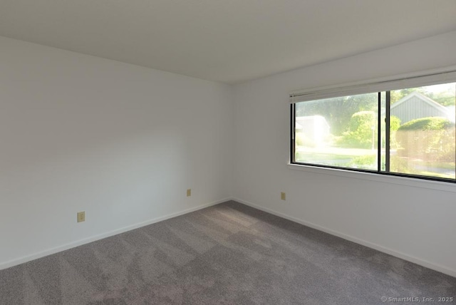 648 Heritage Vlg Unit A, Southbury, CT 06488 - carpeted spare room featuring baseboards