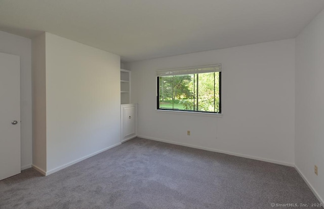 648 Heritage Vlg Unit A, Southbury, CT 06488 - unfurnished room with carpet floors and baseboards
