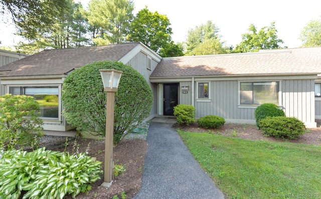 648 Heritage Vlg Unit A, Southbury, CT 06488 - ranch-style house featuring a shingled roof, a front yard, and board and batten siding