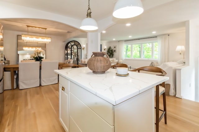 59 Flint Ridge Rd, Monroe, CT 06468 - kitchen featuring light wood-style floors, a kitchen island, open floor plan, white cabinetry, and recessed lighting