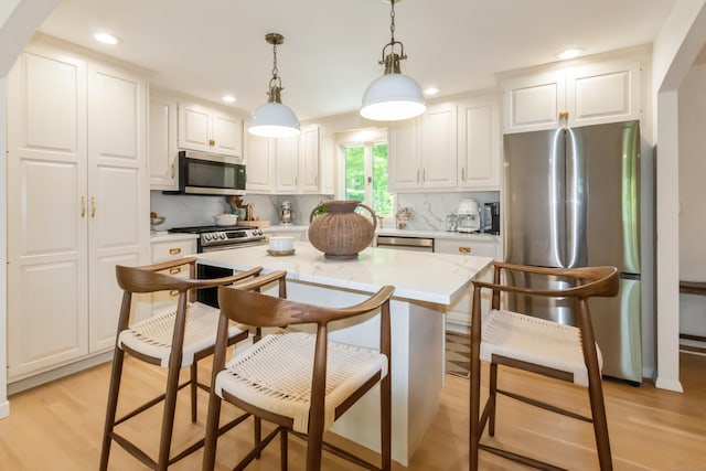 59 Flint Ridge Rd, Monroe, CT 06468 - kitchen with stainless steel appliances, recessed lighting, light countertops, backsplash, and white cabinetry