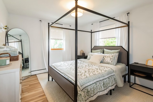 59 Flint Ridge Rd, Monroe, CT 06468 - bedroom with multiple windows, light wood-type flooring, and baseboard heating