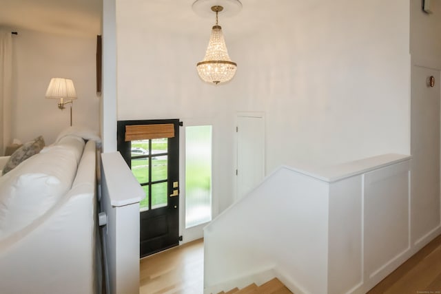 59 Flint Ridge Rd, Monroe, CT 06468 - foyer featuring light wood-style floors, a chandelier, and a towering ceiling