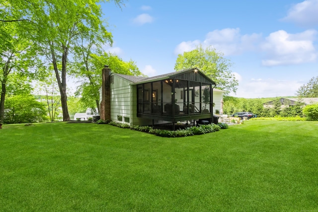 59 Flint Ridge Rd, Monroe, CT 06468 - back of house with a sunroom, a chimney, and a lawn