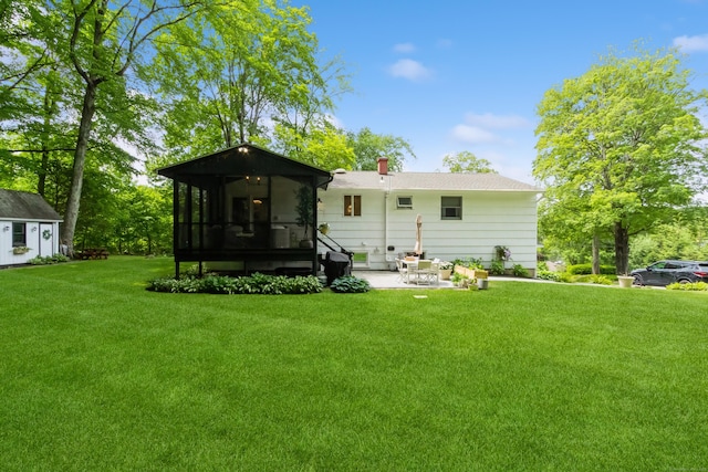 59 Flint Ridge Rd, Monroe, CT 06468 - rear view of property featuring a sunroom, a yard, a patio area, and a chimney