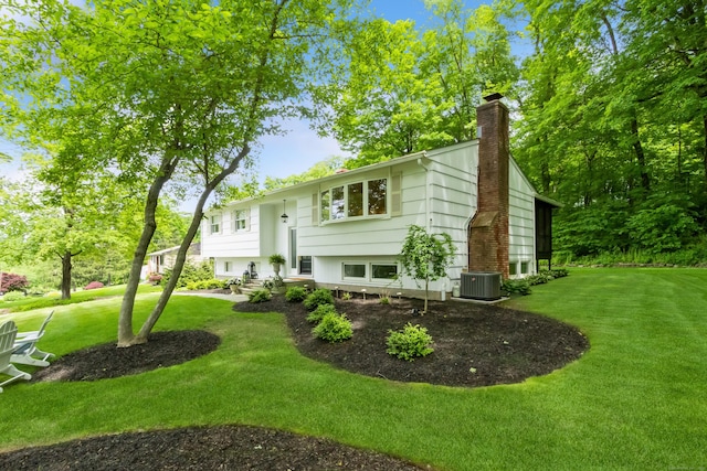 59 Flint Ridge Rd, Monroe, CT 06468 - bi-level home featuring a chimney and a front lawn