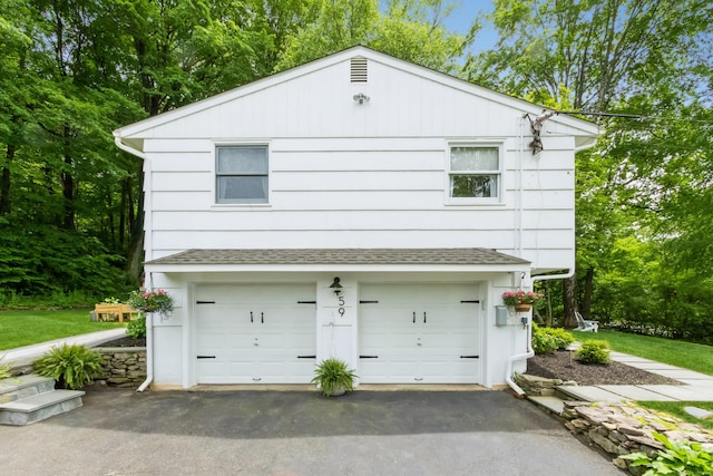 59 Flint Ridge Rd, Monroe, CT 06468 - garage featuring asphalt driveway