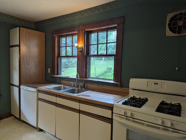 10 Staples St, Danbury, CT 06810 - kitchen with white appliances, wallpapered walls, and white cabinets