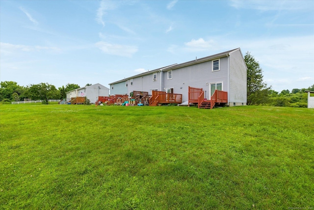 11 Fawn Rdg, Woodstock, CT 06281 - rear view of house with a lawn and a deck