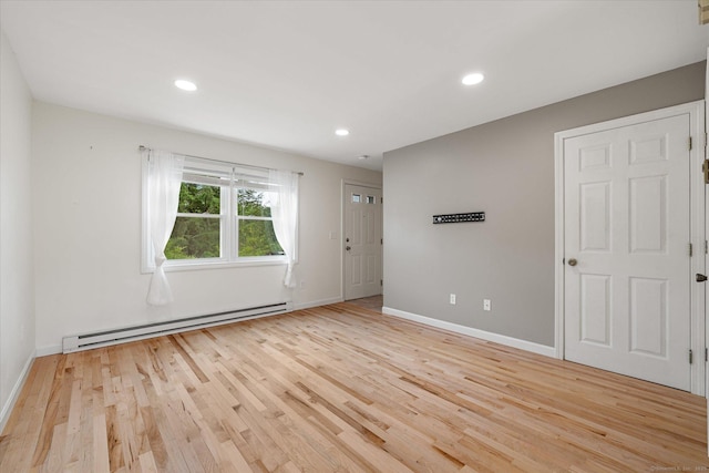 11 Fawn Rdg, Woodstock, CT 06281 - empty room with a baseboard radiator, light wood finished floors, and recessed lighting