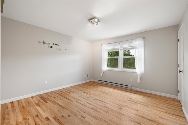 11 Fawn Rdg, Woodstock, CT 06281 - unfurnished room with baseboard heating and light wood-type flooring