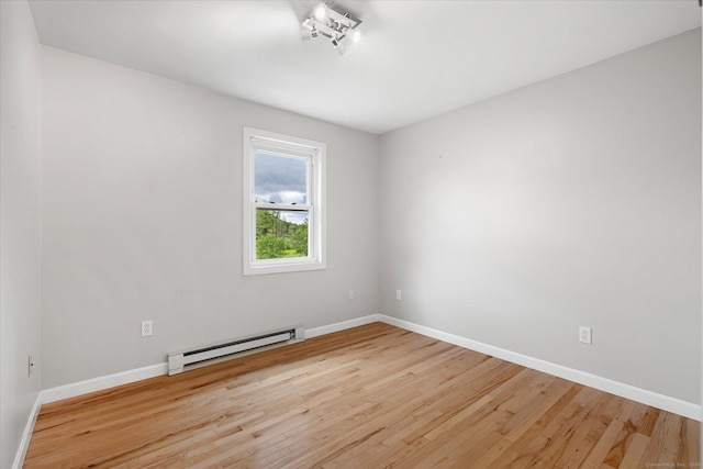 11 Fawn Rdg, Woodstock, CT 06281 - unfurnished room featuring a baseboard radiator and wood finished floors