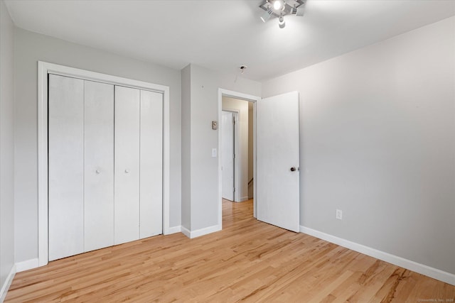11 Fawn Rdg, Woodstock, CT 06281 - unfurnished bedroom featuring light wood-style flooring and a closet