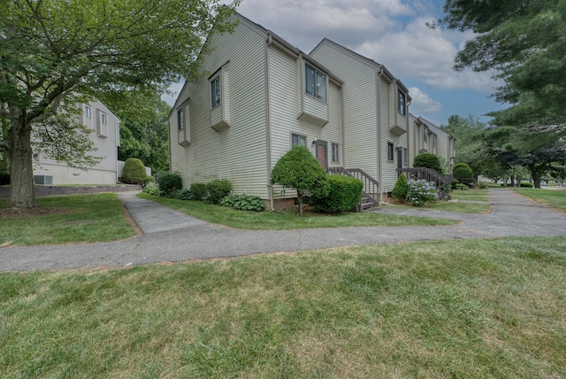 560 Yale Ave Unit 209, Meriden, CT 06450 - view of property exterior with a lawn
