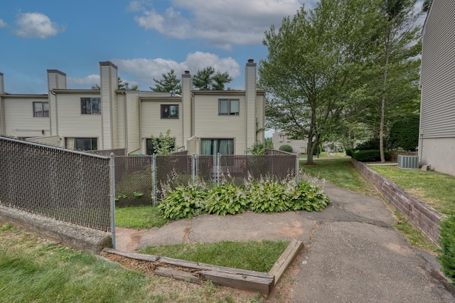 560 Yale Ave Unit 209, Meriden, CT 06450 - rear view of property featuring a chimney