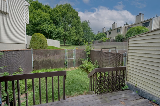 560 Yale Ave Unit 209, Meriden, CT 06450 - wooden deck with a fenced backyard and a gate