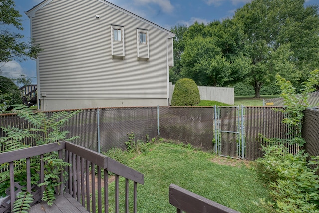 560 Yale Ave Unit 209, Meriden, CT 06450 - fenced backyard with a wooden deck and a gate