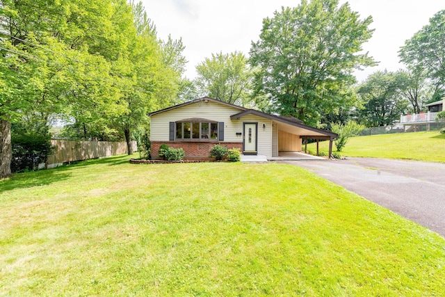 10 Thomas St, Windsor Locks, CT 06096 - view of front of house with brick siding, asphalt driveway, and an attached carport