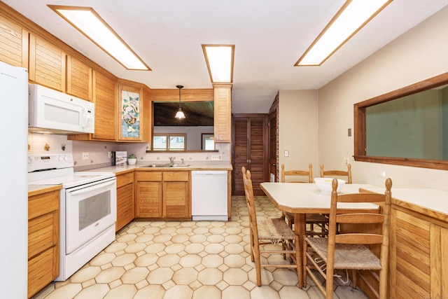 10 Thomas St, Windsor Locks, CT 06096 - kitchen with white appliances, light countertops, light floors, decorative light fixtures, and backsplash