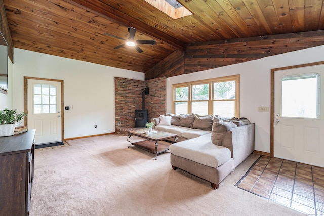 10 Thomas St, Windsor Locks, CT 06096 - living room with a wood stove, ceiling fan, carpet flooring, a skylight, and wood ceiling