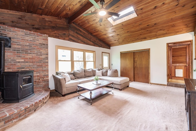 10 Thomas St, Windsor Locks, CT 06096 - carpeted living room featuring a wood stove, a ceiling fan, a skylight, and wooden ceiling