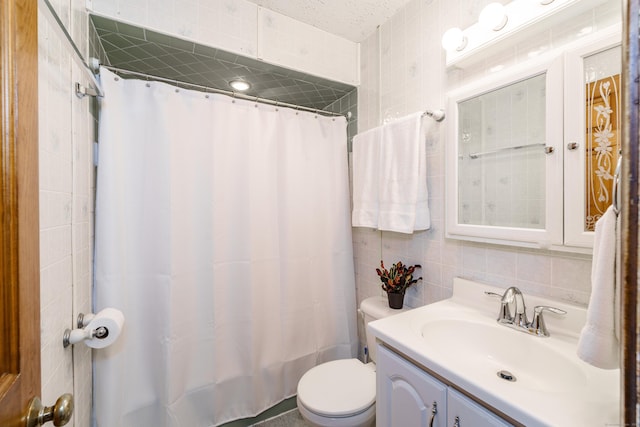 10 Thomas St, Windsor Locks, CT 06096 - bathroom featuring tile walls, vanity, and tasteful backsplash