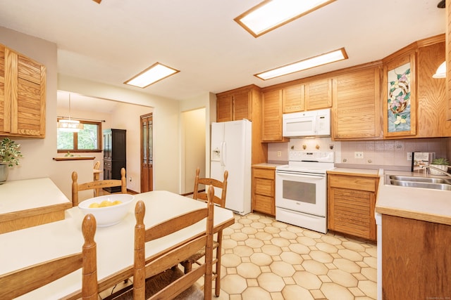 10 Thomas St, Windsor Locks, CT 06096 - kitchen featuring white appliances, light countertops, light flooring, tasteful backsplash, and decorative light fixtures