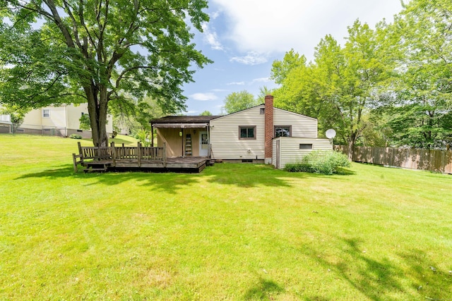 10 Thomas St, Windsor Locks, CT 06096 - back of property with a deck and a chimney