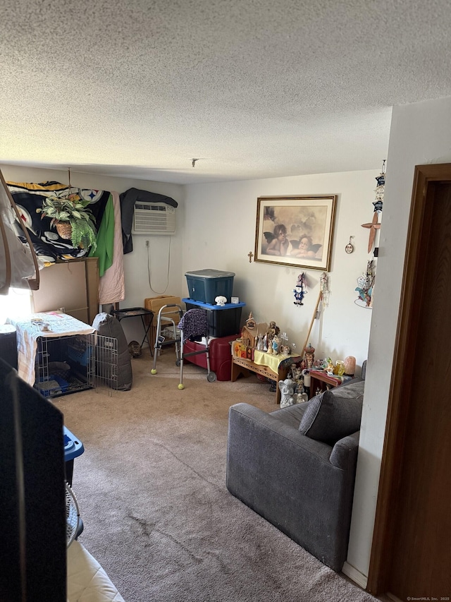 531 Meriden Rd Unit 2, Waterbury, CT 06705 - living room featuring a wall unit AC, a textured ceiling, and carpet