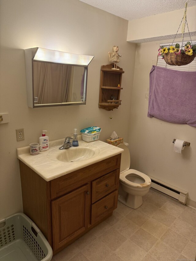 531 Meriden Rd Unit 2, Waterbury, CT 06705 - bathroom featuring baseboard heating, vanity, and a textured ceiling