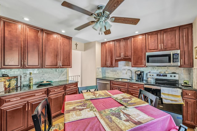 59 Laurel Wood Dr, Shelton, CT 06484 - kitchen with stainless steel appliances, a ceiling fan, backsplash, and recessed lighting