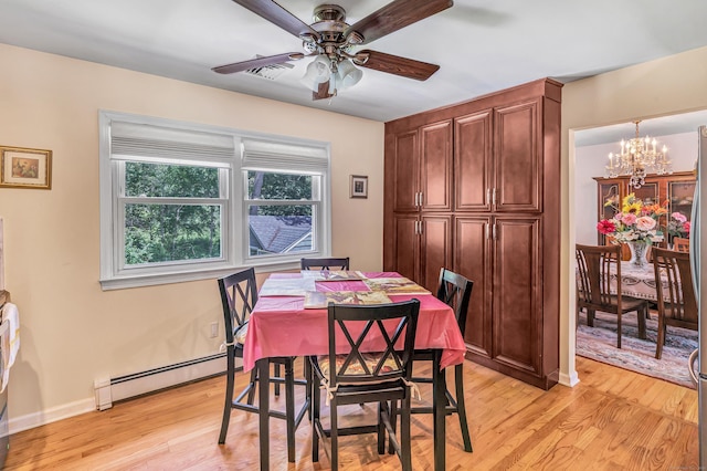 59 Laurel Wood Dr, Shelton, CT 06484 - dining area featuring baseboard heating, a chandelier, light wood-style floors, and a ceiling fan