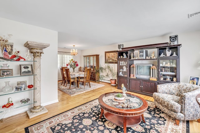 59 Laurel Wood Dr, Shelton, CT 06484 - living room with a chandelier and light wood-style floors