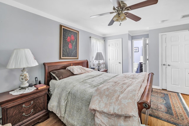 59 Laurel Wood Dr, Shelton, CT 06484 - bedroom with wood finished floors, a ceiling fan, and ensuite bath