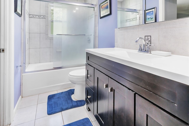 59 Laurel Wood Dr, Shelton, CT 06484 - bathroom featuring vanity, tile patterned floors, shower / bath combination with glass door, and tasteful backsplash
